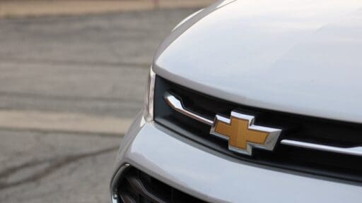 white GM car on road during daytime