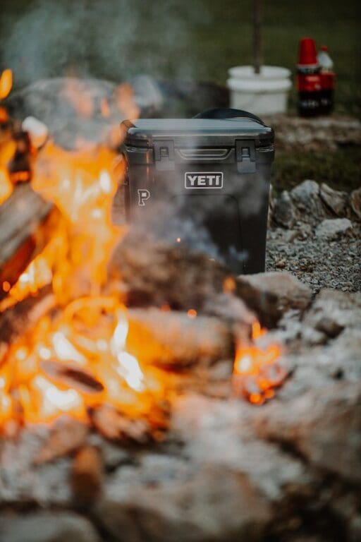 black plastic yeti trash bin on fire