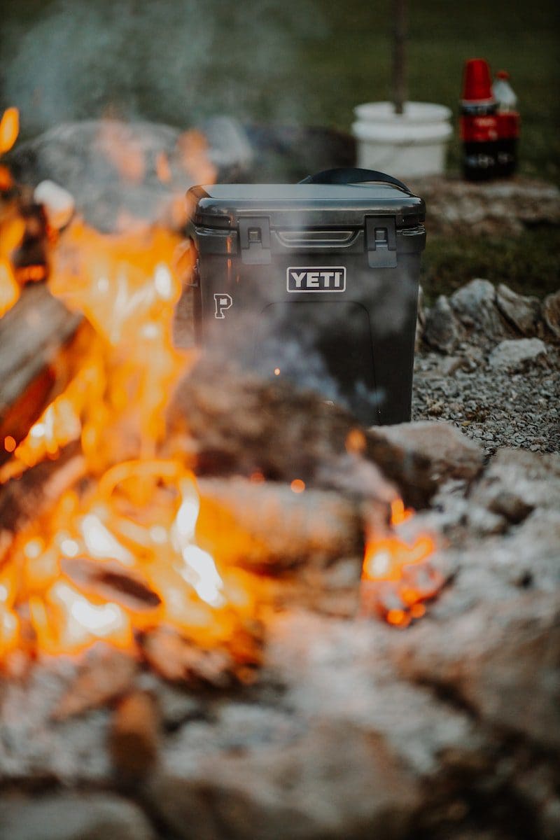 black plastic yeti trash bin on fire
