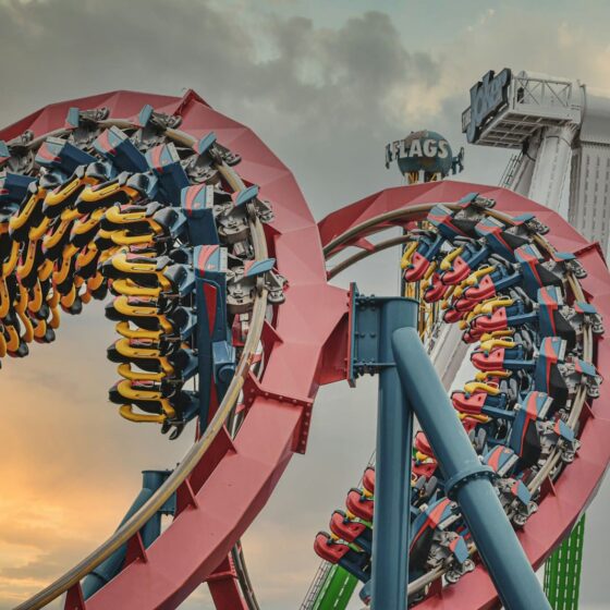 red and yellow roller coaster at six flags