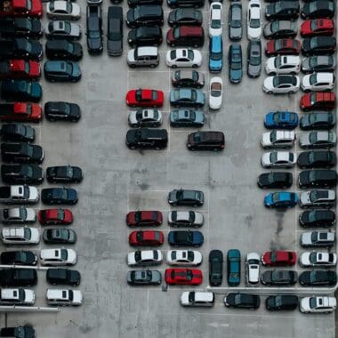 aerial photography of cars on motor source parking lot