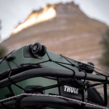 a close up of a Thule boat with a mountain in the background